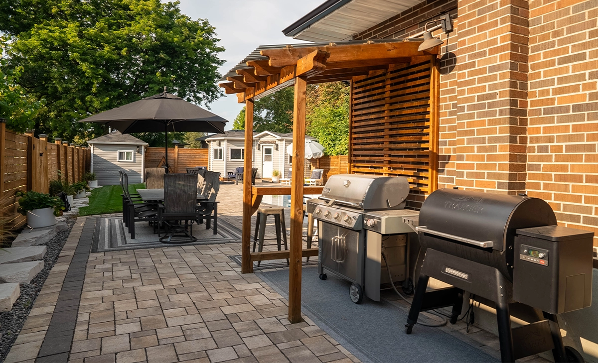 outdoor kitchen and dining area outdoor kitchen and dining area, interlocking floor, home backyard