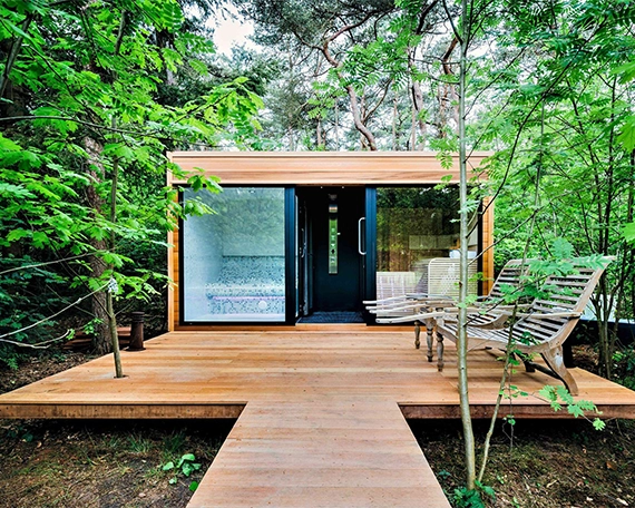 outdoor sauna with deck and outdoor sitting setup