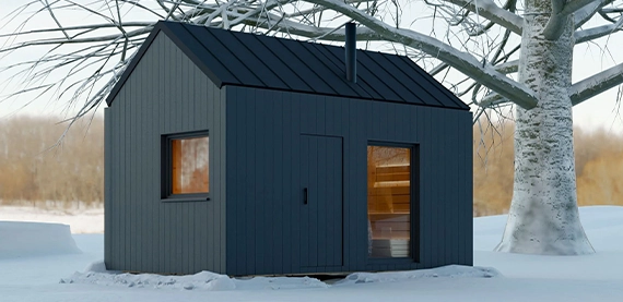 outdoor sauna covered with snow in outside space