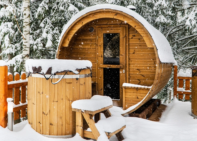 outdoor sauna and plunge pool, snow falling winter view