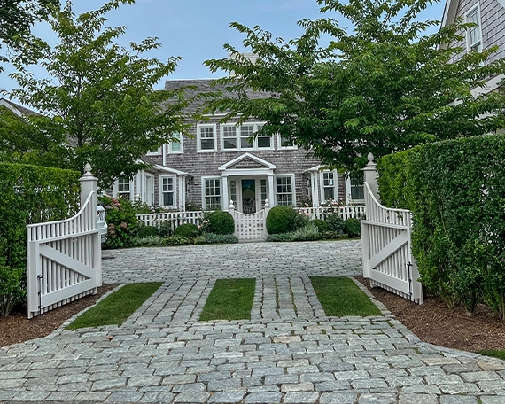 luxury home front, permeable driveway and front yard, wooden fence gate, sodding and landscaping