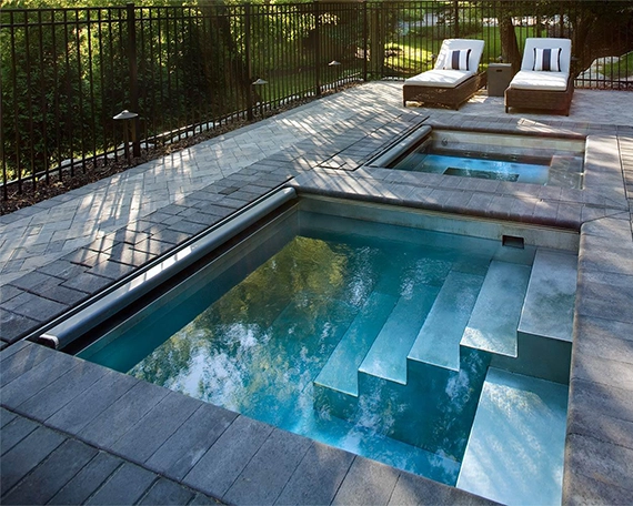 two size plunge pool with interlock surface and aluminium fence in yard