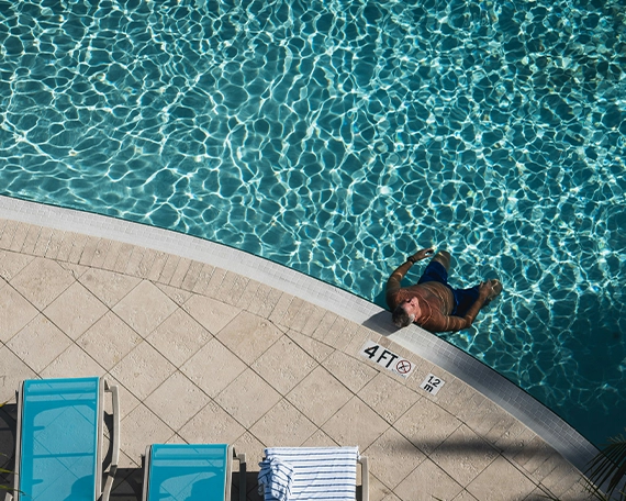 top view of man in pool, 4 feet width pool coping