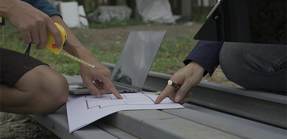 pool permit image two team taking measurement by looking at drawing