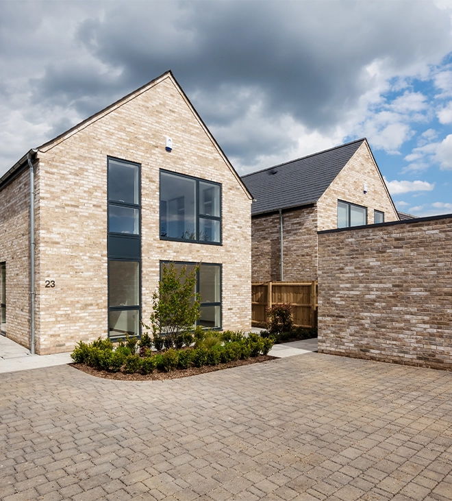 residential building and front permeable pavers driveway