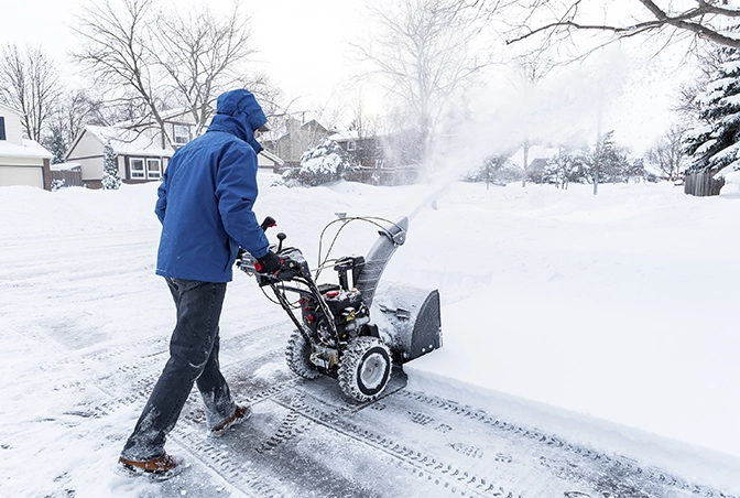 man snow pillowing on residential private road