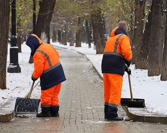 crew removing snow from walkways