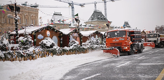 snow removal image six snow removal tractor clearing snow from road