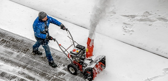 man snow plow on road