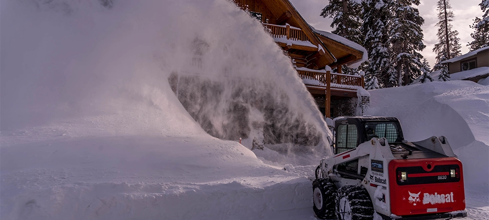 snow sweeper removes snow from the road