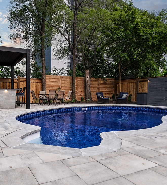 swimming pool with pool coping and interlocking surface