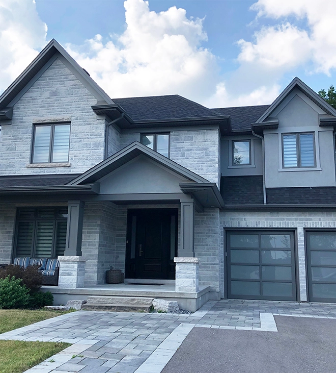 luxury home with well-designed custom interlocking driveway