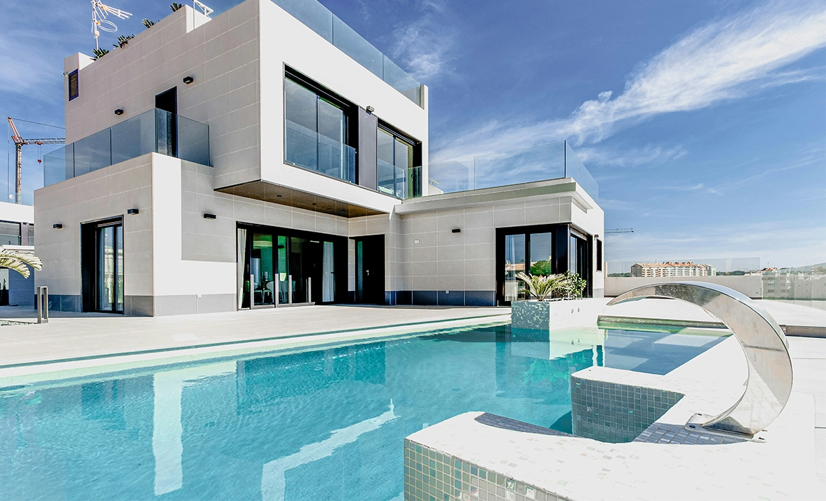 waterfall in large pool, front of luxury residential building