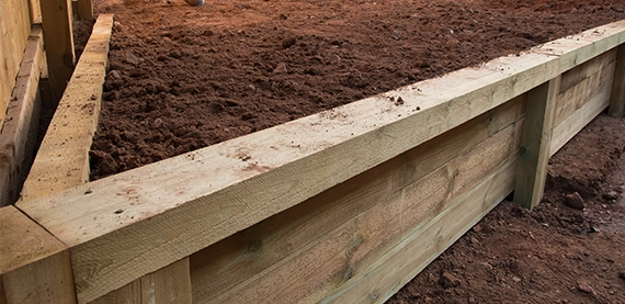 wooden retaining wall image four wooden retaining wall hold soil
