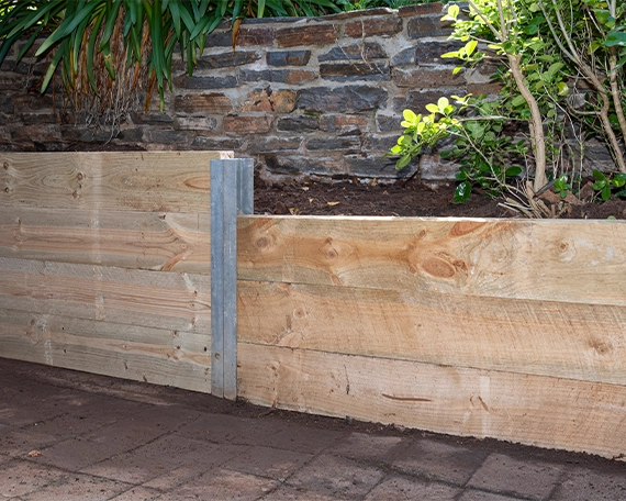wooden retaining wall image three soil between wooden retaining wall and rock wall
