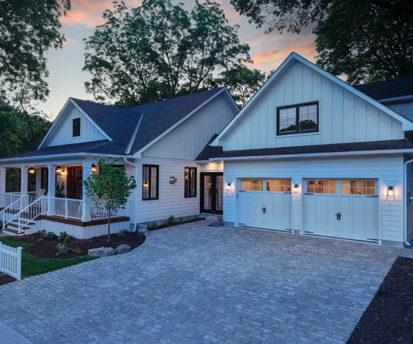 large home with a big interlocked driveway in the evening