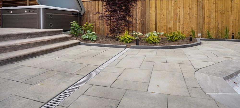 landscaping and hardscaping with water drainage system