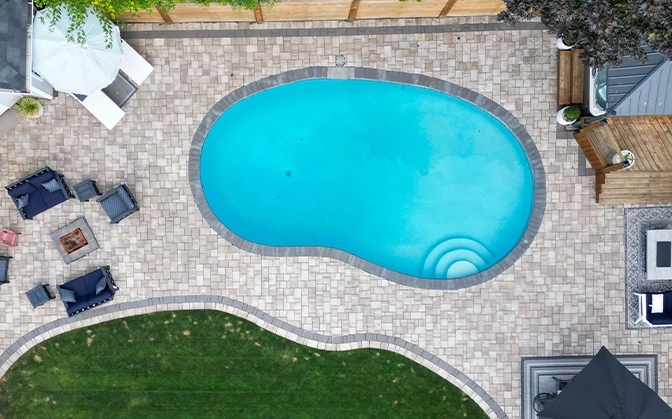 interlocking surface around pool. full backyard top view
