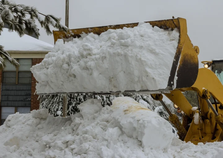 Snow removal with truck to clear parking lot and road of snow