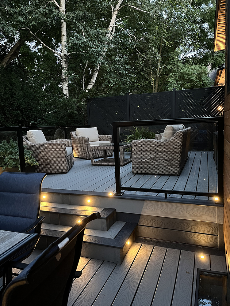 Deck-Construction deck in a backyard with lights