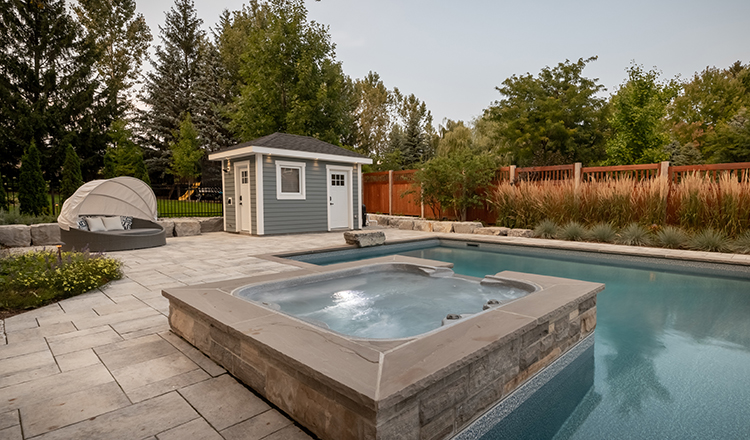 hot-tub-and-pool large backyard with a pool and a jacuzzi and pool house