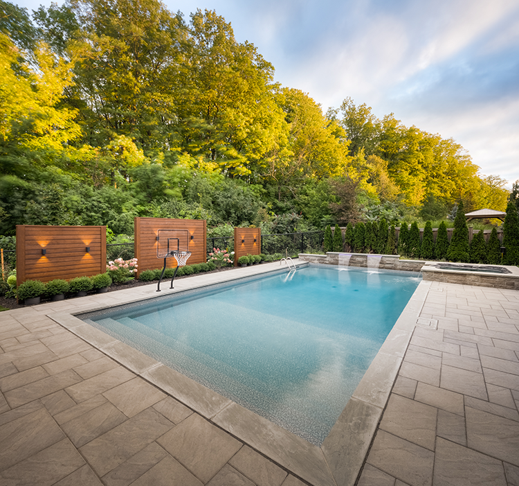 pool-permits backyard with a pool and interlocking