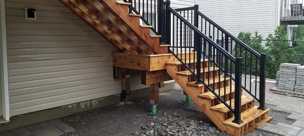 pressure treated lumber, with helical piles from Techno Metal Post and custom engineered brackets
