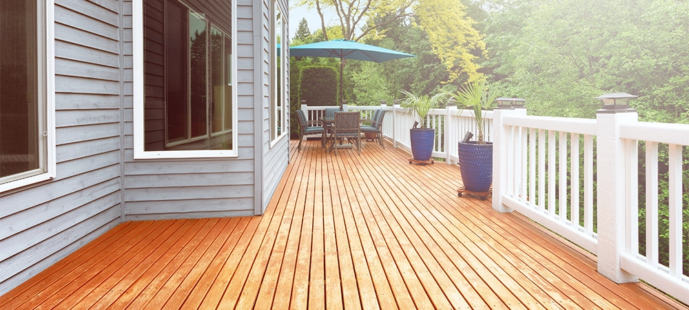 Outdoor home outdoor wooden deck during bright daylight in summer time