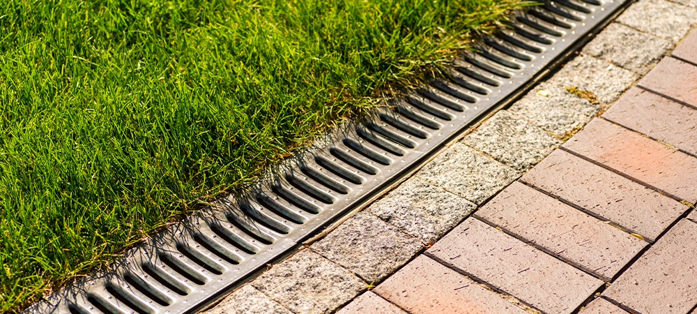 Rainwater gutters for rain along the lawn